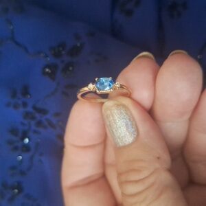 New aquamarine ring size 7 gold color,non metal info.